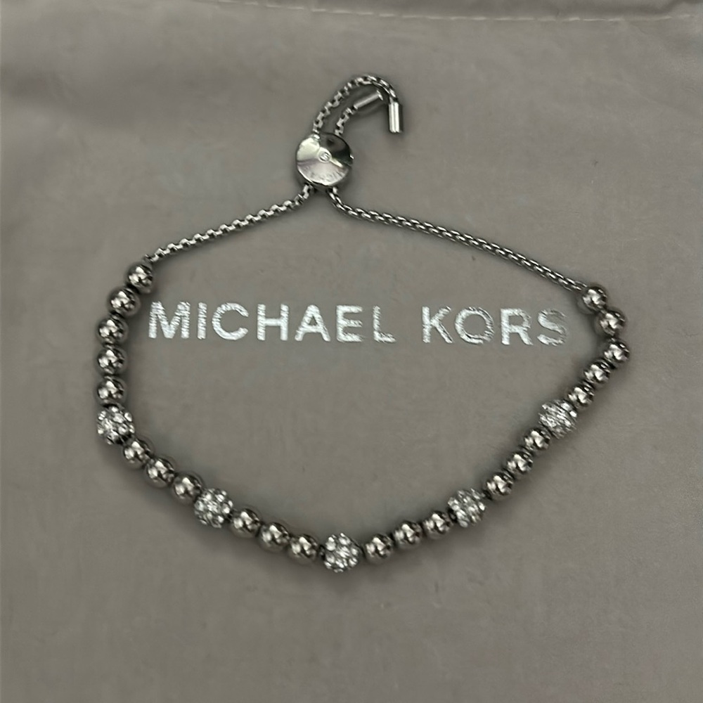 Michael Kors silver slider bracelet. No missing gems